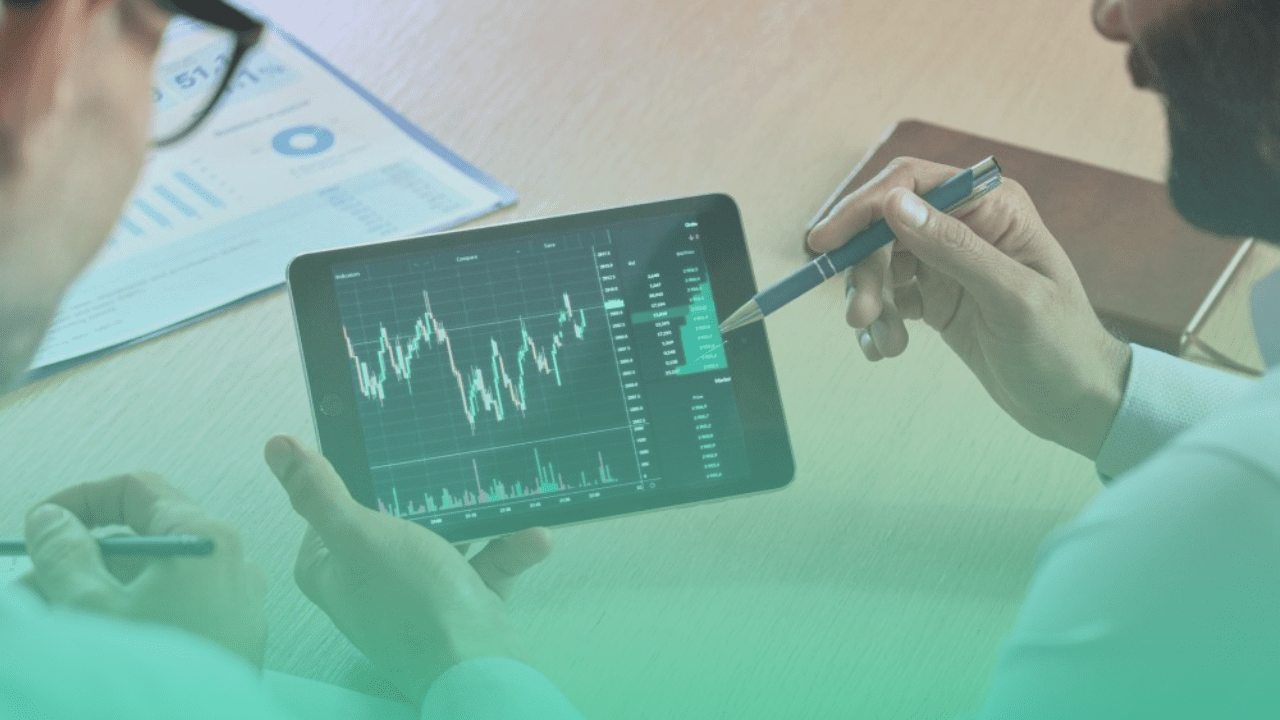 Trader consulting investor showing crypto trading chart using digital tablet for expert advisors.